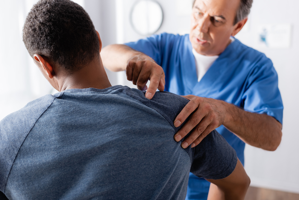 Unveiling Hidden Post-Accident Care Pitfalls - chiropractor examining patient
